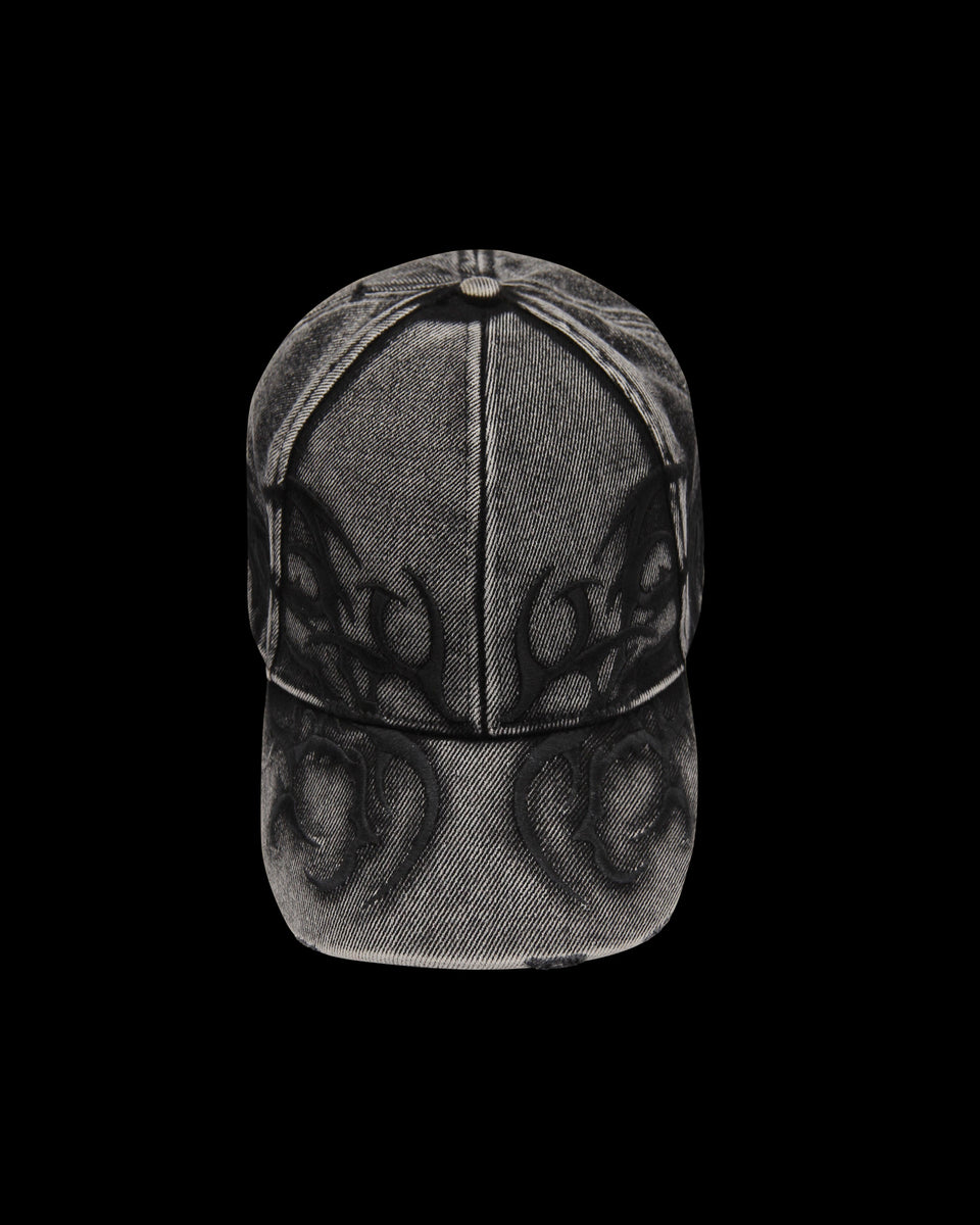 The NAMED COLLECTIVE® CRASH EMBROIDERED DENIM CAP in washed black, shown front-facing on a black background.