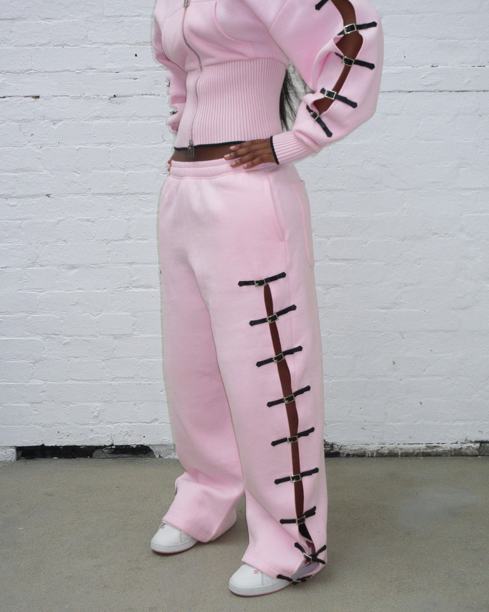 Crush buckle oversized sweatpants baby pink with buckle fastening design.