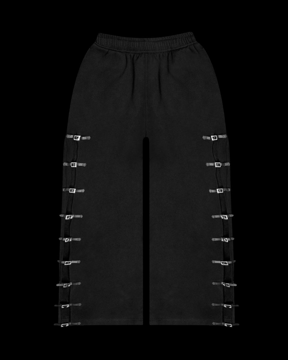 Crush buckle oversized sweatpants black displayed on a black background.