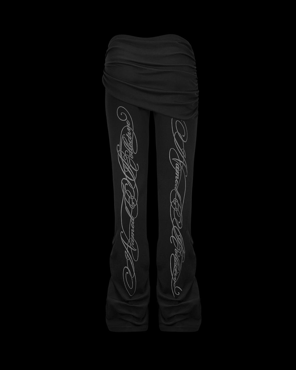 Crush sculpt stretch drape pants black displayed on a black background.