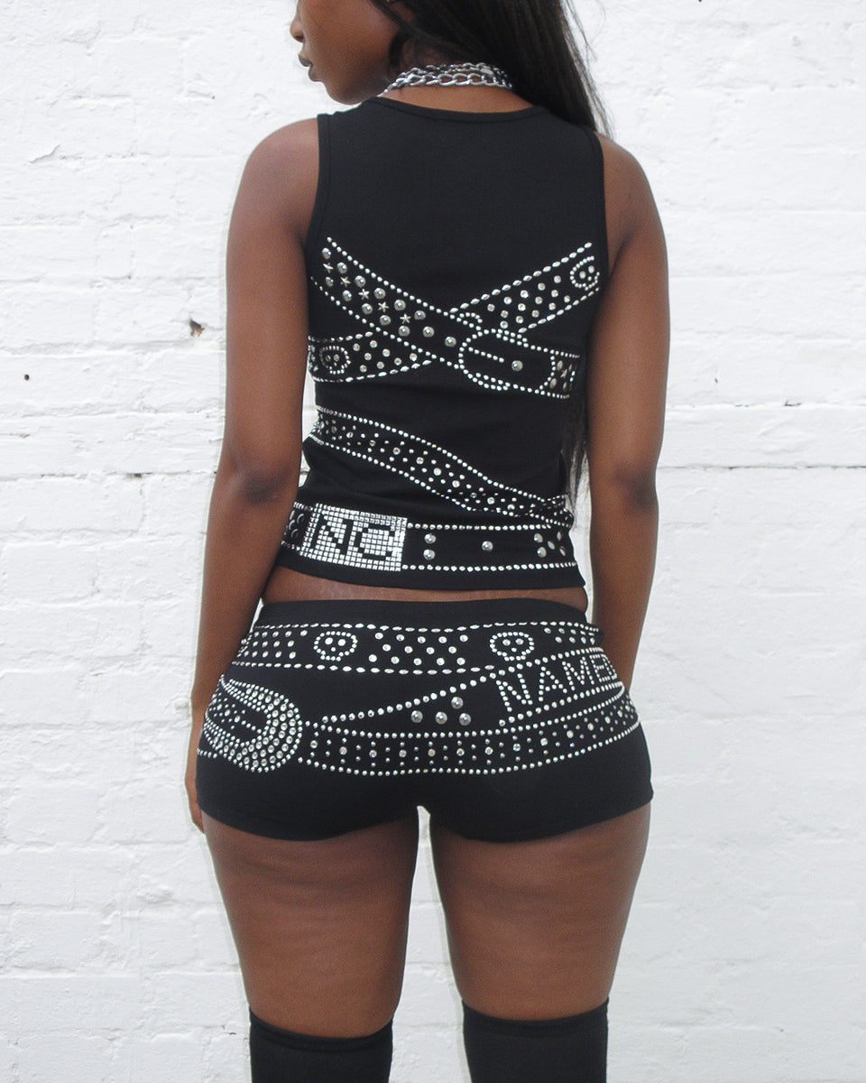 Back view of model wearing Crush studded belt micro hotpant shorts black.