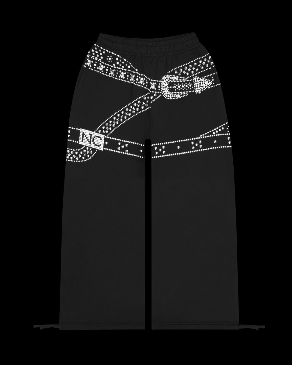 Crush studded belt oversized sweatpants black displayed on a black background.