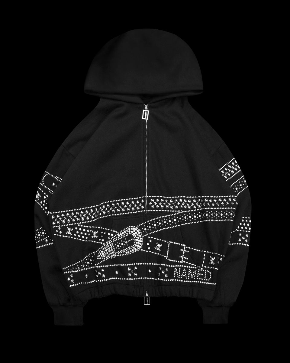 Crush studded belt zip hoodie black displayed on black background.