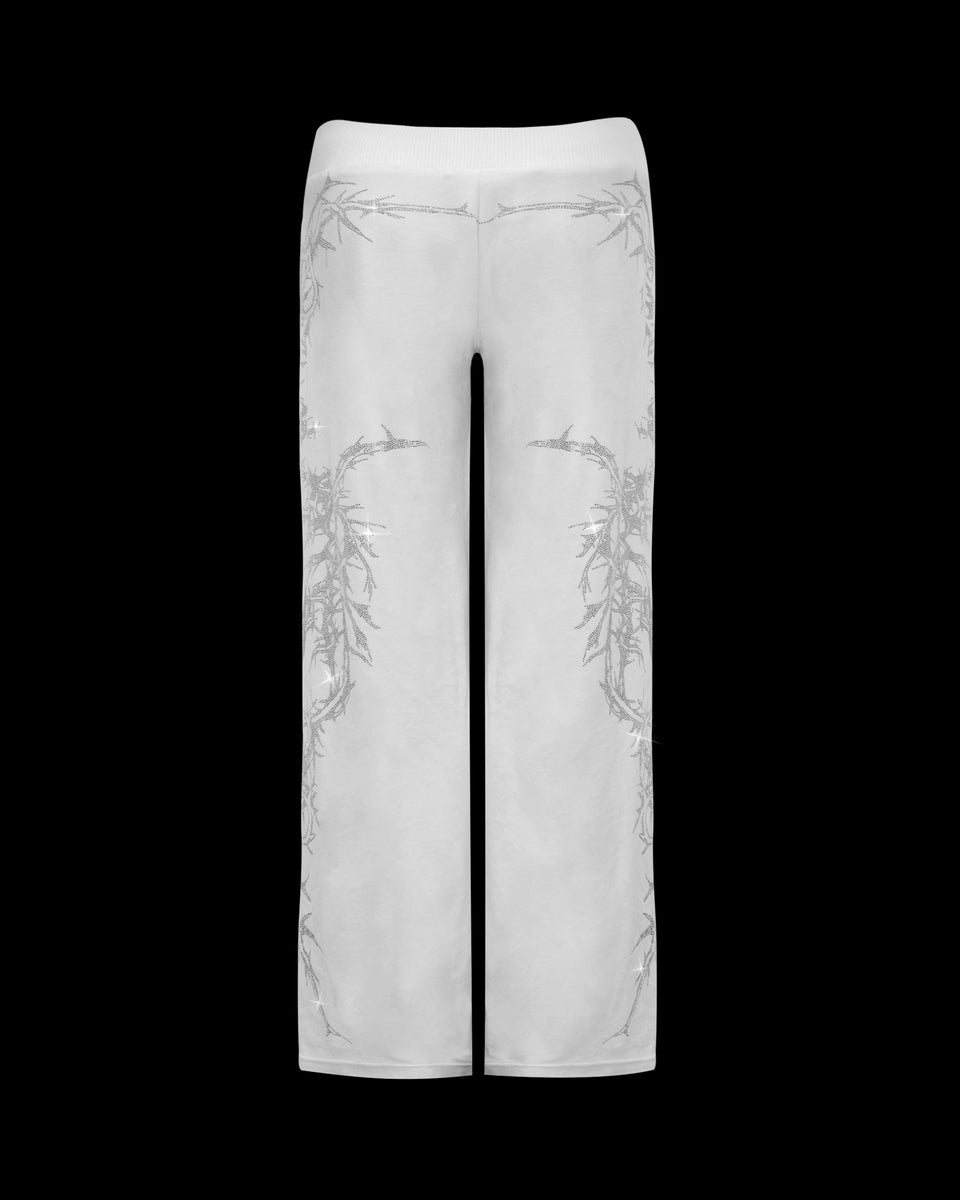 NAMED COLLECTIVE® CURSE RHINESTONE VELOUR SWEATPANTS SALT: white straight-leg pants with grey side and back detailing.