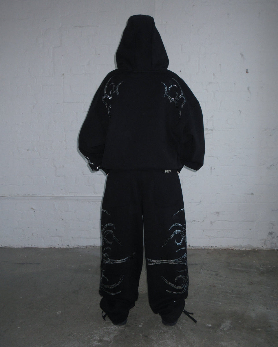 EUPHORIA DISTRESSED PRINT CHROME OVERSIZED SWEATPANTS BLACK