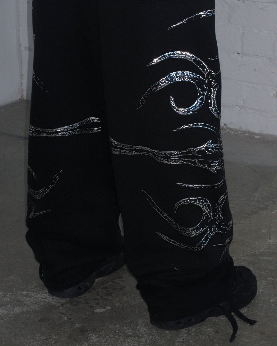 EUPHORIA DISTRESSED PRINT CHROME OVERSIZED SWEATPANTS BLACK