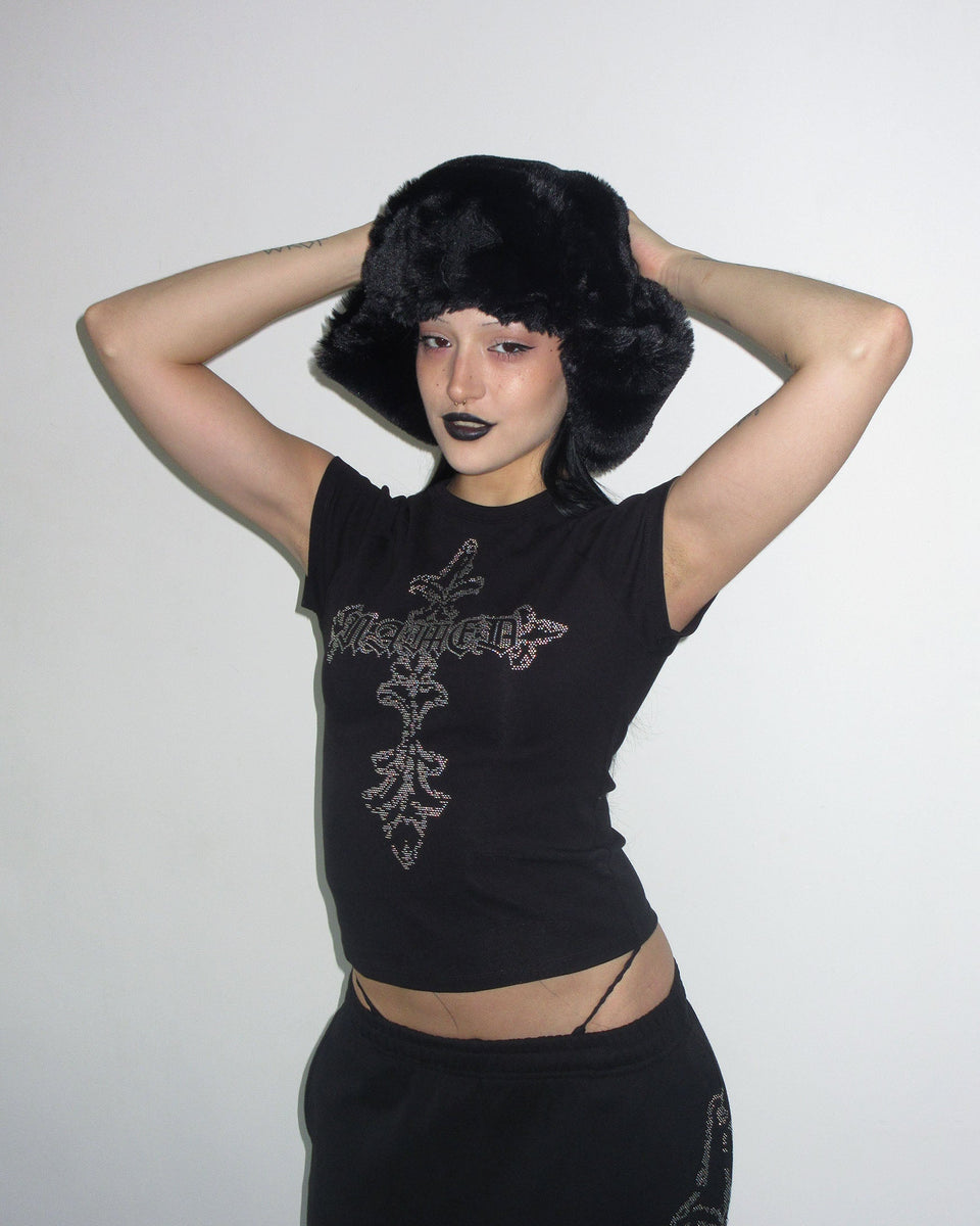Model wears NAMED COLLECTIVE® FERAL STUDDED BABY TEE BLACK and poses against a plain white background.