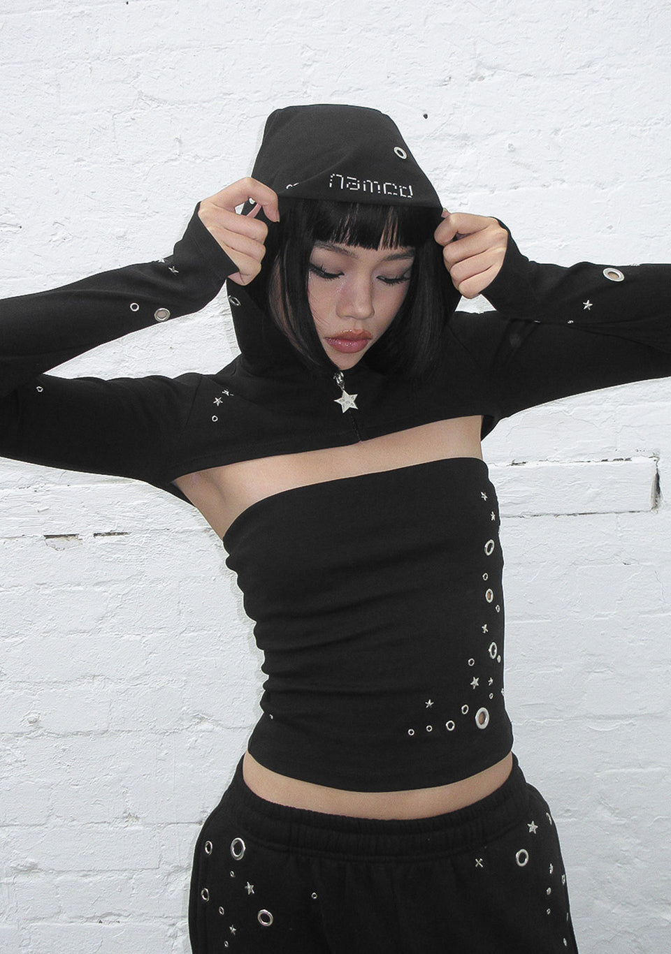 GLITCH EYELET ZIP HOODED SHRUG