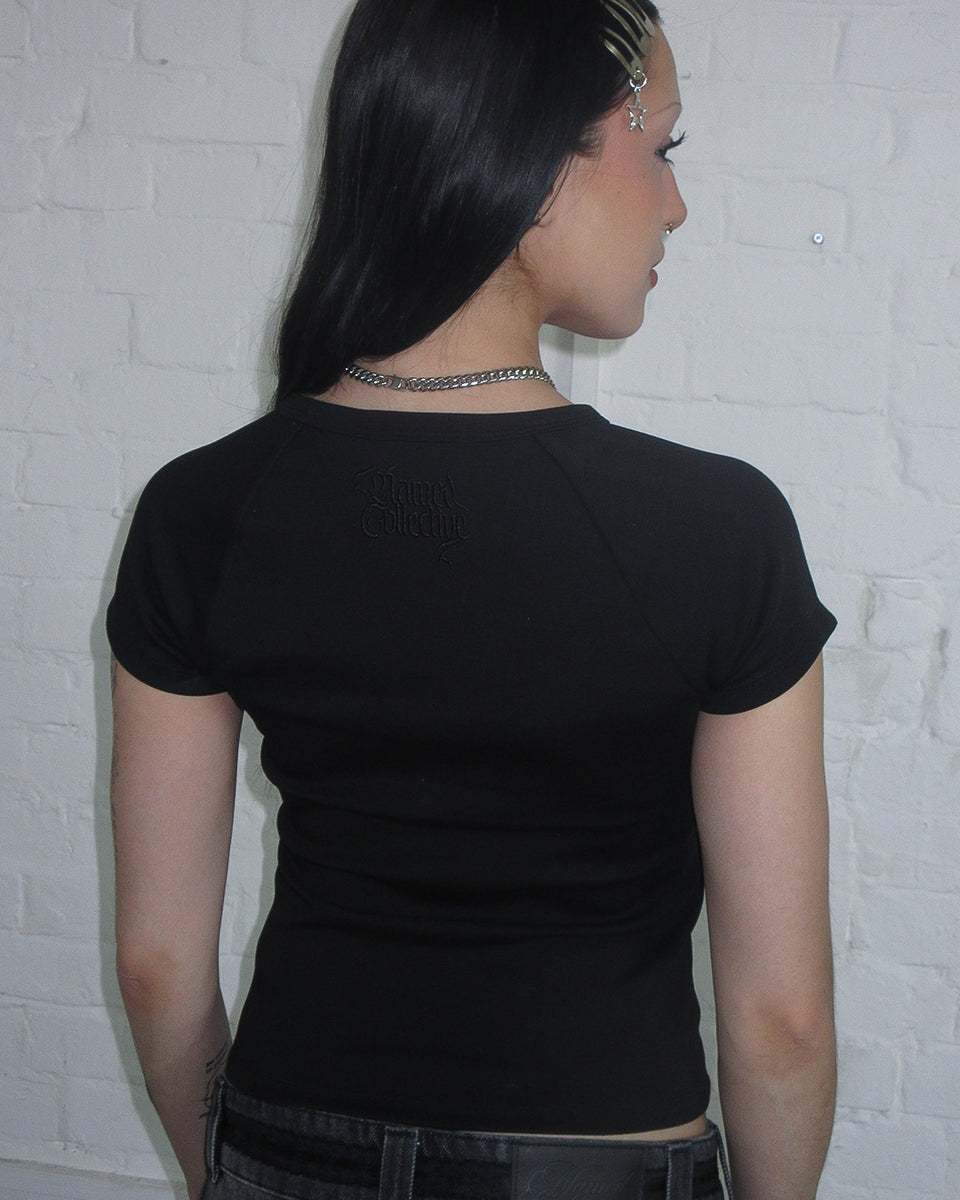 NOCTURNAL RHINESTONE BOW BABY TEE BLACK
