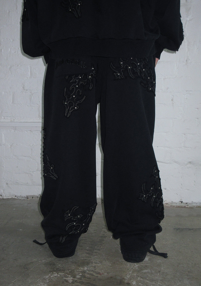 SINNER STUDDED OVERSIZED SWEATPANTS BLACK VINTAGE WASH