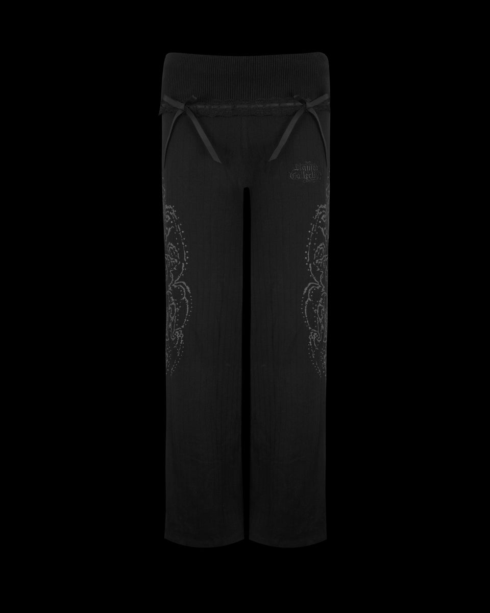 WHISPER RIBBON POINTELLE SCULPT PANTS BLACK by NAMED COLLECTIVE® feature wide legs, drawstring waist, and leg patterns.